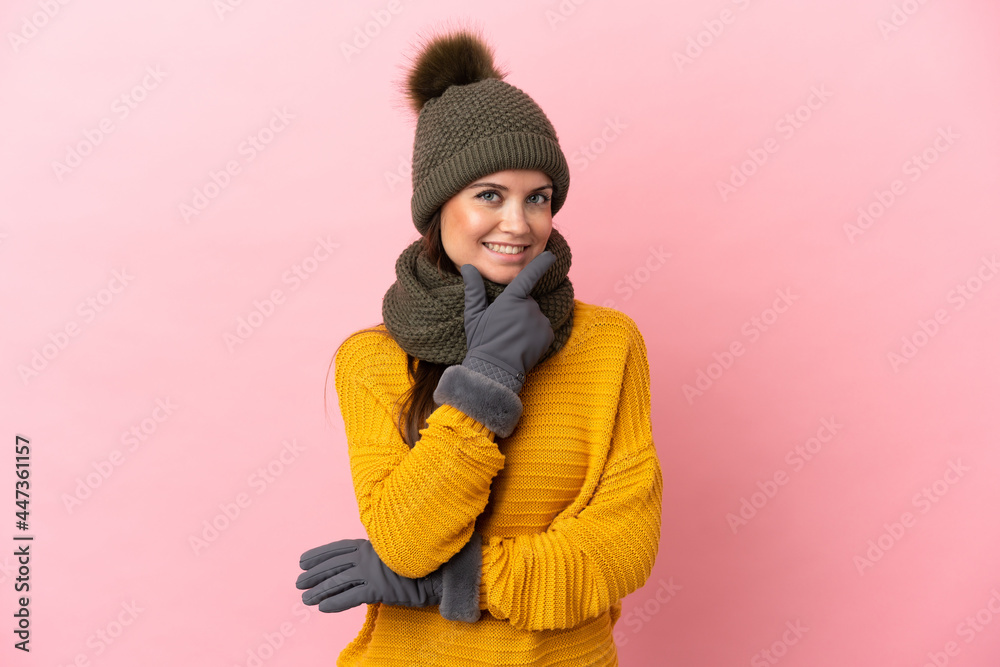 Young caucasian girl with winter hat isolated on pink background happy and smiling Young caucasian girl with winter hat isolated on pink background happy and smiling