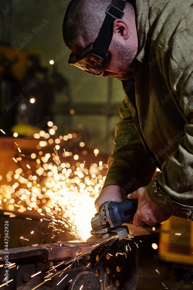 Industrial worker welding steel