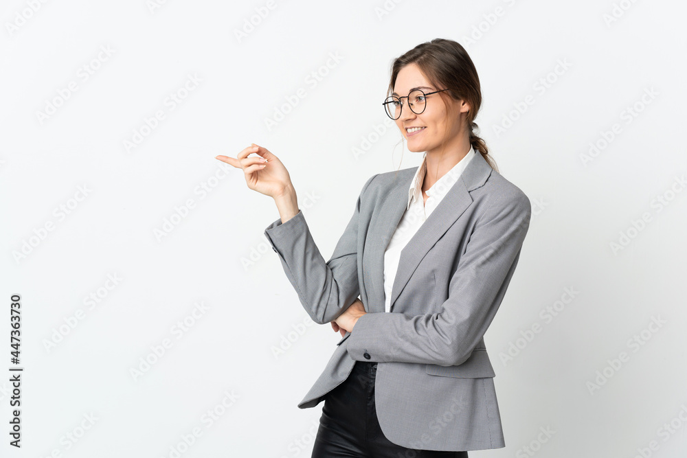 Business Ireland woman isolated on white background pointing finger to the side Business Ireland woman isolated on white background pointing finger to the side