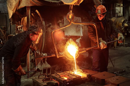 Steel workers in factory