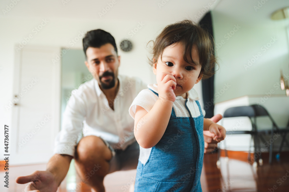 little toddler children with first walk step with stairs at home, small baby person are happy to play and learn to crawling with family, cute infant boy having fun and childhood care