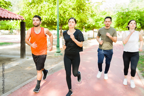 Group of friends in activewear jogging