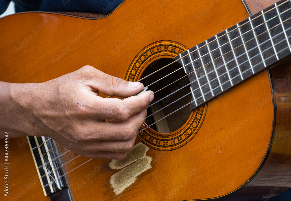 Fototapeta premium man playing acoustic guitar