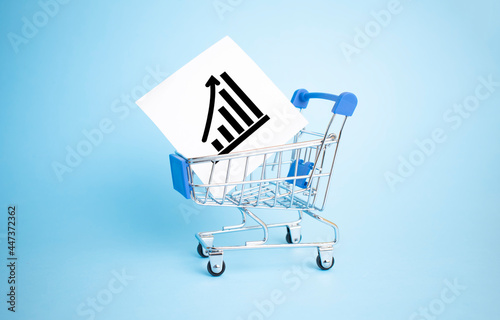 Online shopping is growing up,Shopping cart on the blue background