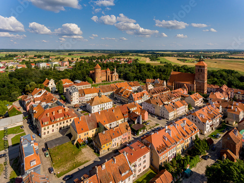 Panorama of the city of Reszel - Castle and the Church of Saint Apostles Peter and Paul in Reszel, town hall and buildings with red roofs photo