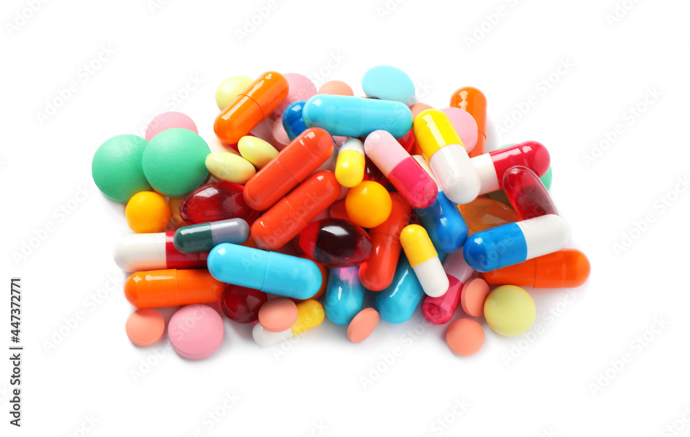Pile of different colorful pills on white background, above view Pile of different colorful pills on white background, above view