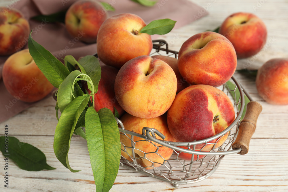 Fresh ripe juicy peaches on white wooden table Fresh ripe juicy peaches on white wooden table