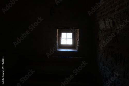 Small window in dark room