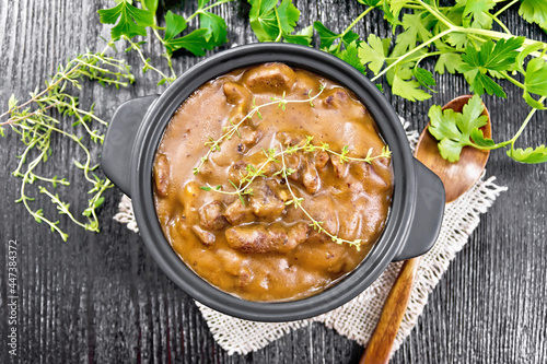 Goulash of beef in pan on dark board top