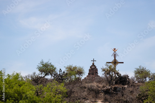 The cross of the apostolate at the top of a hill next to the ex hacienda Pozo del Carmen, Armadillo de los Infante, San Luis Potosi photo