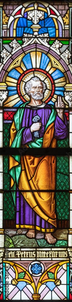VIENNA, AUSTIRA - JUNI 24, 2021: The St. Peter the Apostle on the stained glass of church St. Severin.