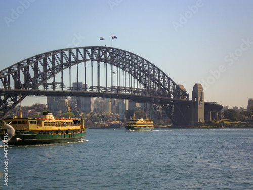Fototapeta Naklejka Na Ścianę i Meble -  Daytime view of ferry boats and Sydney Harbour Bridge at Sydney, New South Wales, Australia