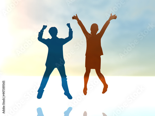 ジャンプして喜ぶ2人の若者の男女シルエット