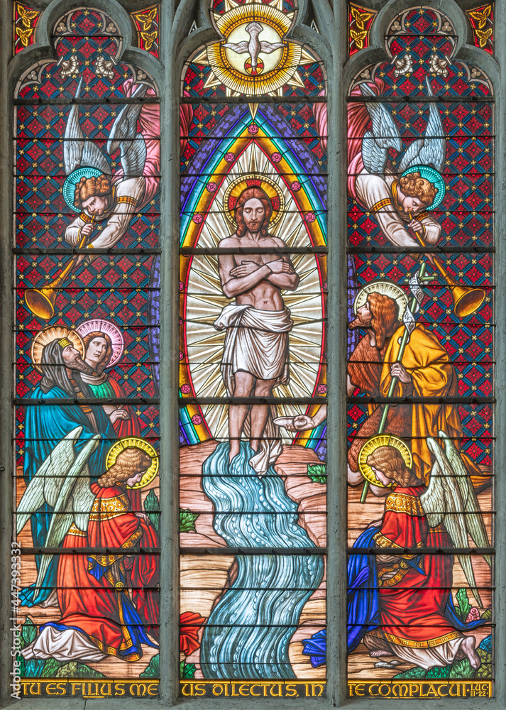 VIENNA, AUSTIRA - JUNI 24, 2021: The  Baptism of Jesus on the stained glass in the Votivkirche church originaly by workrooms from Austria.