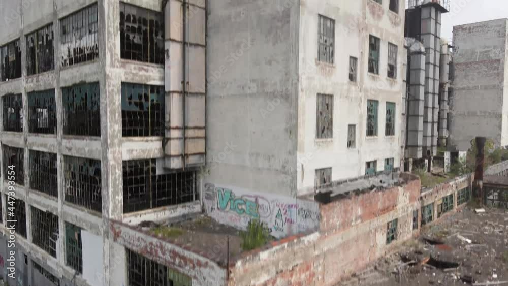 Abandoned Fisher Body Automotive Plant 21 in Detroit, Michigan drone shot moving upwards in corner. Abandoned Fisher Body Automotive Plant 21 in Detroit, Michigan drone shot moving upwards in corner.