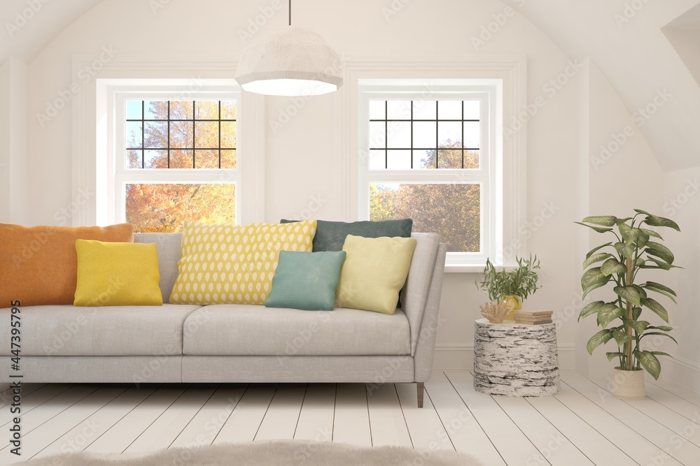 Fototapeta premium Stylish room in white color with sofa and autumn landscape in window. Scandinavian interior design. 3D illustration