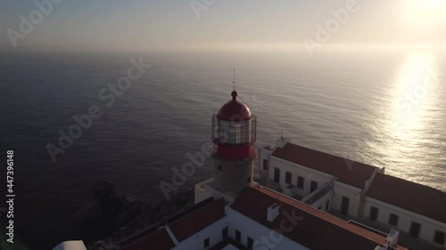 Cinematic aerial shot showcasing the cupola of the Cape Saint Vincent lighthouse, diffused sunlights. 
