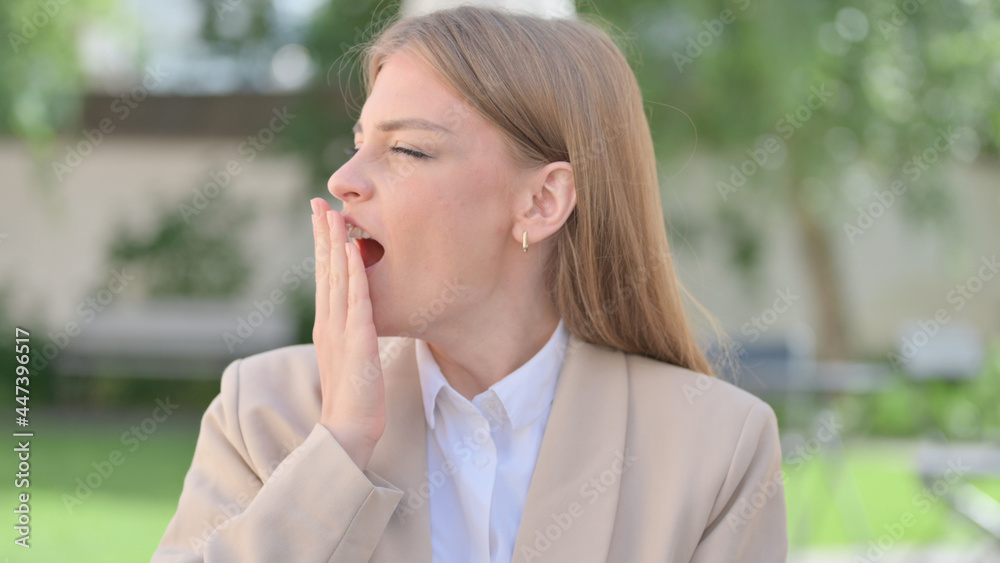 Outdoor Portrait of Sleeping Businesswoman Yawning Outdoor Portrait of Sleeping Businesswoman Yawning