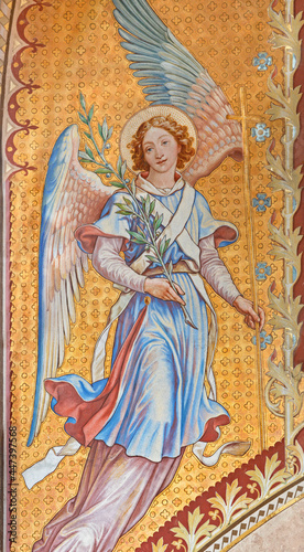 VIENNA, AUSTIRA - JUNI 24, 2021: The fresco of angel with the flower in the Votivkirche church by brothers Carl and Franz Jobst (sc. half of 19. cent.). © Renáta Sedmáková