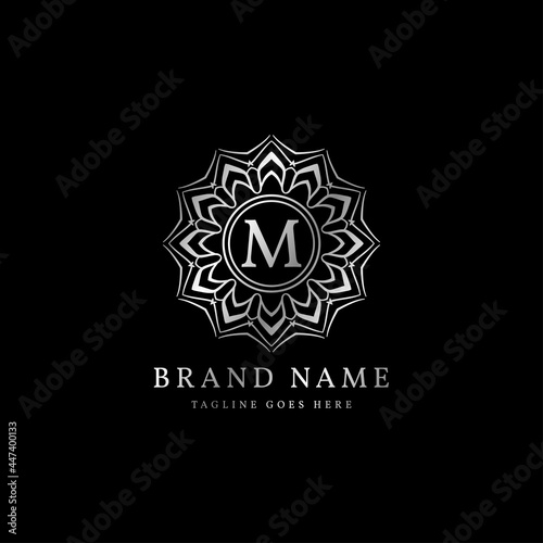 abstract round luxury letter M logo design for elegant fashion brand, beauty care, yoga class, hotel, resort, jewelry