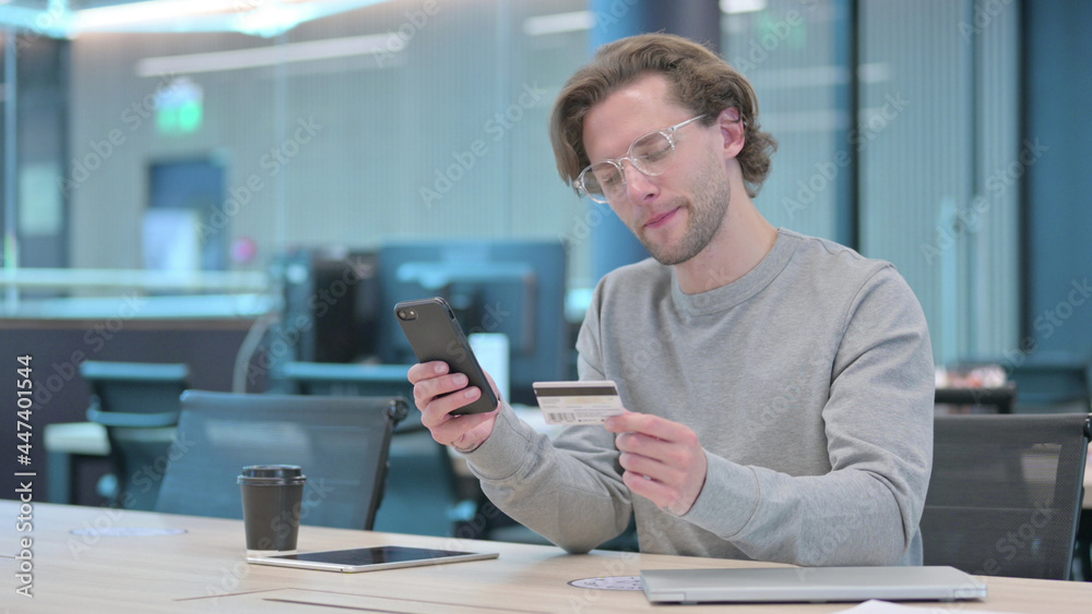 Young Man with Unsuccessful Online Payment on Smartphone Young Man with Unsuccessful Online Payment on Smartphone