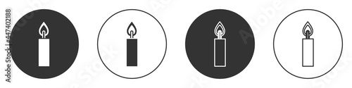 Black Burning candle icon isolated on white background. Cylindrical candle stick with burning flame. Circle button. Vector