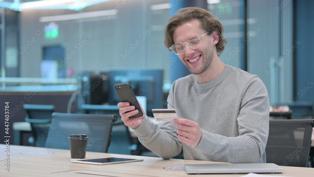 Young Man Doing Online Shopping on Smartphone Young Man Doing Online Shopping on Smartphone