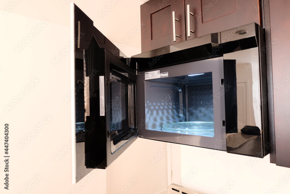 View inside of empty clean microwave oven, selective focus. Microwave interior with door opened. It is called View inside of empty clean microwave oven, selective focus. Microwave interior with door opened. It is called