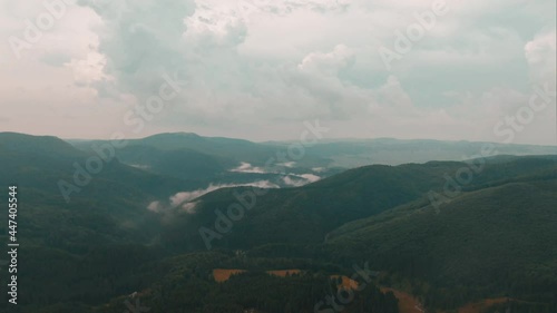 Rain Falling At Mountain Range With Green Forest In Izvoare, Europe. - aerial photo