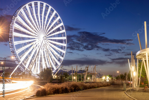 Long exposure of a Ferris wheel at dusk