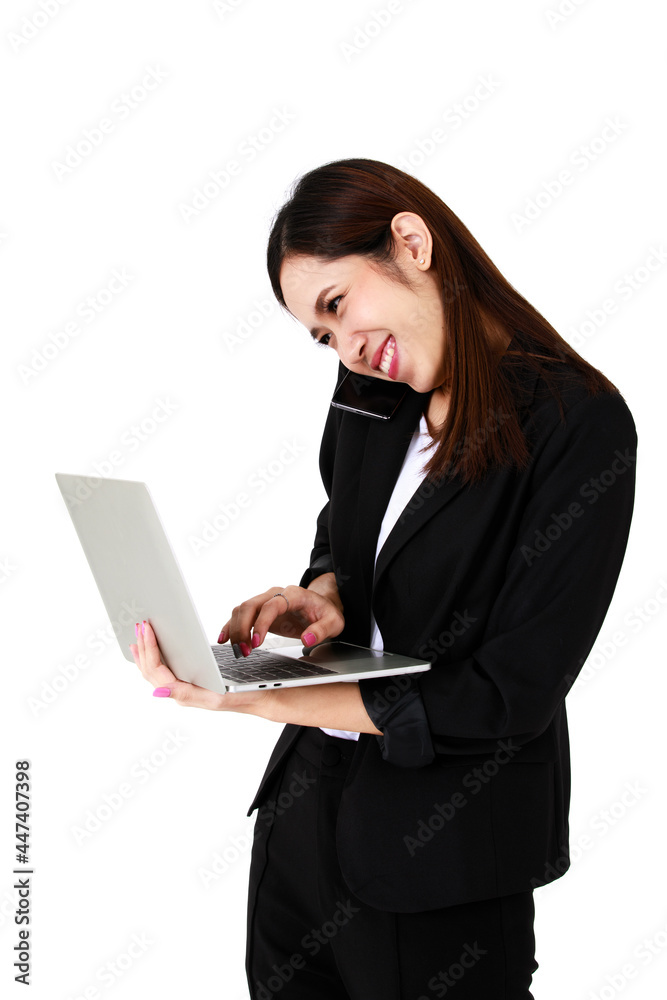 Asian young long brown hair pretty successful secretary businesswoman wears black formal suit hold gray laptop computer in hand stand smile look at monitor when typing in front of white background