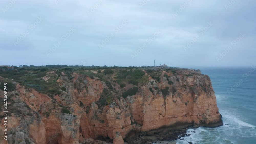 Sensational aerial drone view flying above Lagos Portugal coastline, cloudy day, flying forward Sensational aerial drone view flying above Lagos Portugal coastline, cloudy day, flying forward