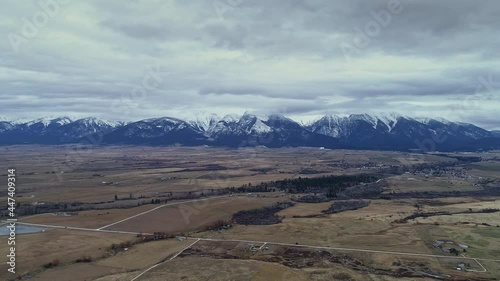 Aerial shot over rural Montana pushing towards Mission Range in distance, 4K photo
