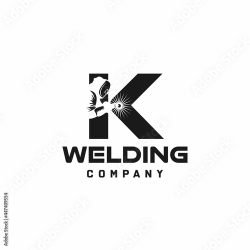 Letter K welding logo, welder silhouette working with weld helmet in simple and modern design style art