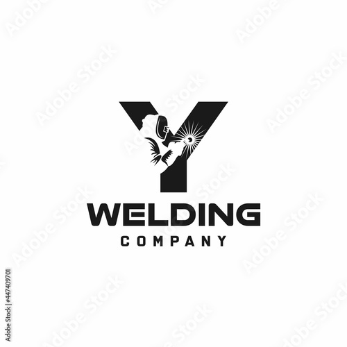 Letter Y welding logo, welder silhouette working with weld helmet in simple and modern design style art