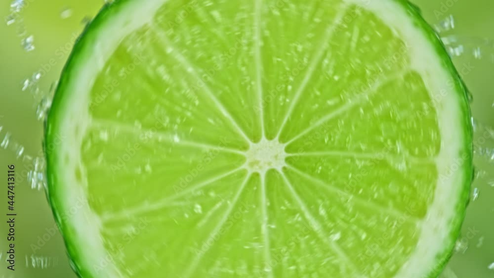 Super Slow Motion Shot of Splashing Water from Rotating Lime Slice at 1000fps. Super Slow Motion Shot of Splashing Water from Rotating Lime Slice at 1000fps.