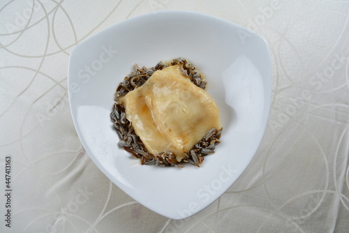 braised luxury fish maw with millet in white background asian halal seafood menu