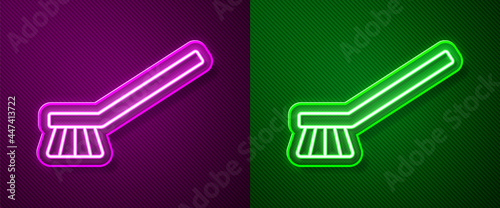 Glowing neon line Brush for cleaning icon isolated on purple and green background. Cleaning service concept. Vector