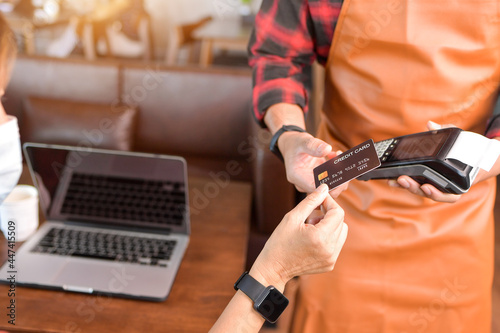 Moment of payment with a credit card through terminal