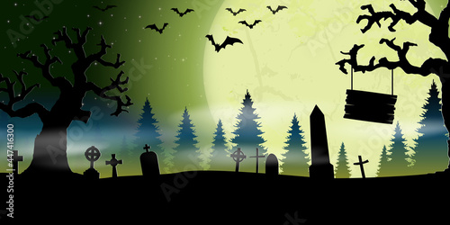 halloween cemetery in front of woodlands with full moon