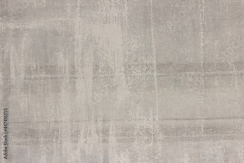 An uneven, ragged grid with small cells. Abstract rough texture with spots and stripes.