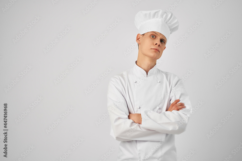 a man in a chef's uniform professional work in a restaurant