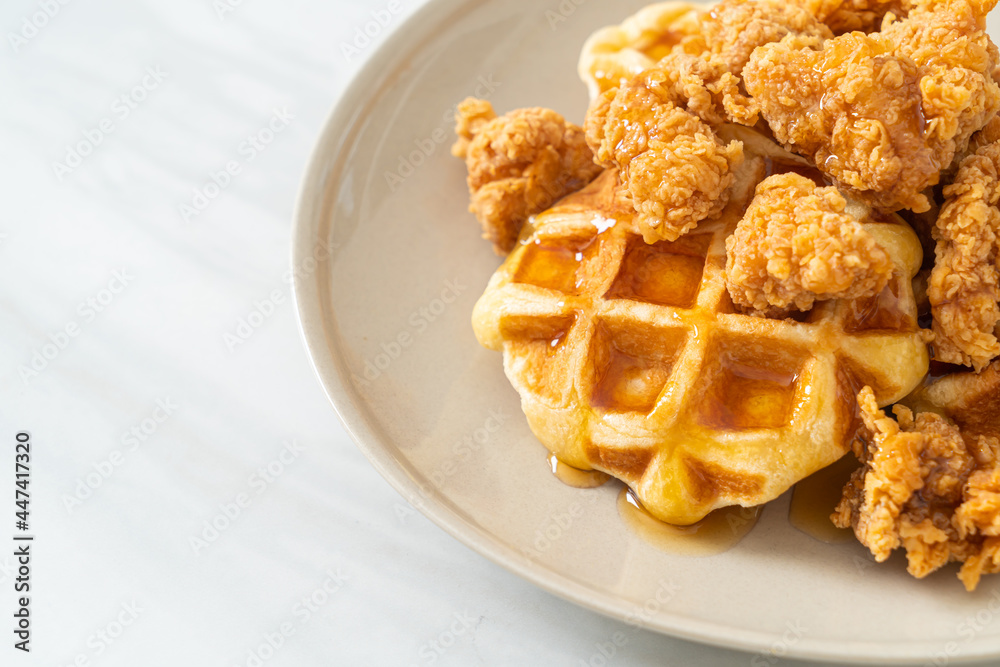 fried chicken waffle with honey or maple syrup fried chicken waffle with honey or maple syrup