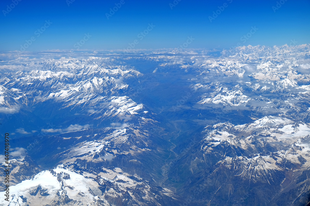 aerial top bird eye view of Himalaya snow mountain range from an air plane in Ladakh, north india