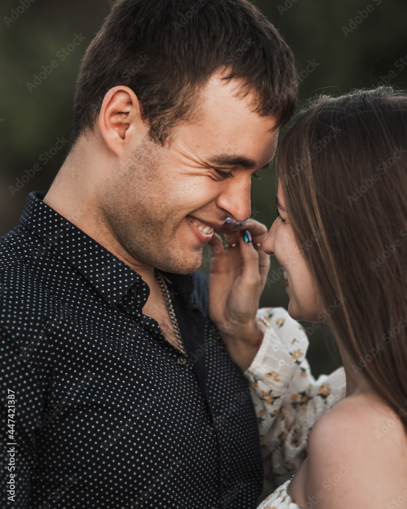 Close up sensual portrait of young couple in love, together, happy, looking at each other Close up sensual portrait of young couple in love, together, happy, looking at each other