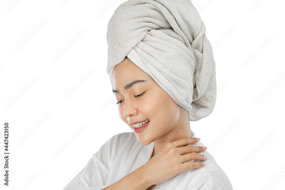 beautiful girl with bath towel on head with hands beside neck on gray background beautiful girl with bath towel on head with hands beside neck on gray background