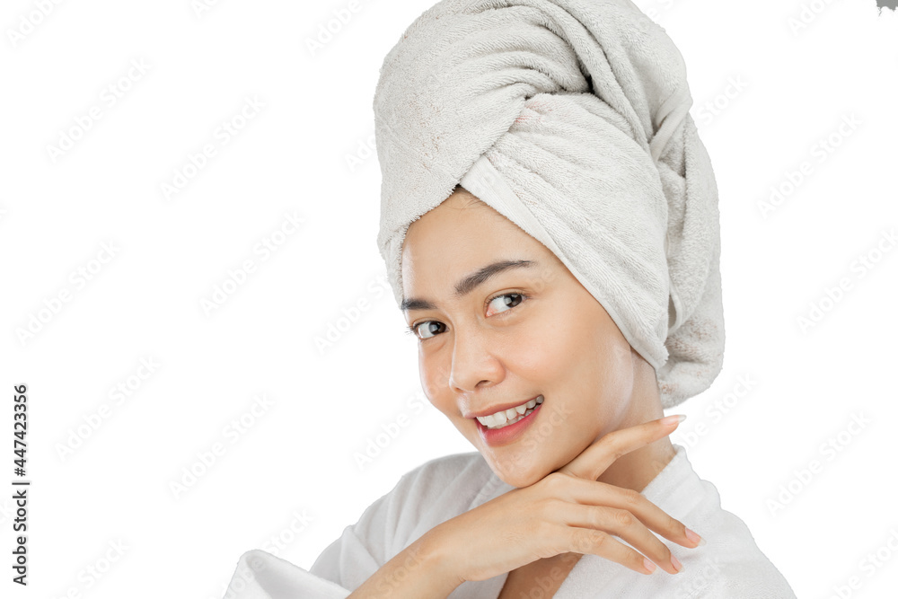 asian girl with bath towel on head smiling with hands under chin on gray background asian girl with bath towel on head smiling with hands under chin on gray background