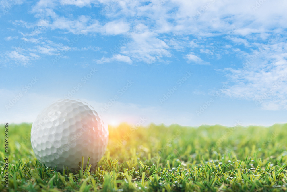 golf ball on tee blue sky background;open space for copy golf ball on tee blue sky background;open space for copy