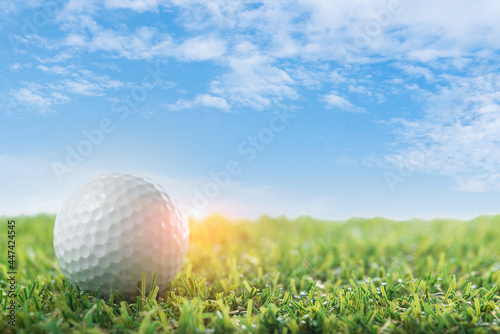 golf ball on tee blue sky background open space for copy