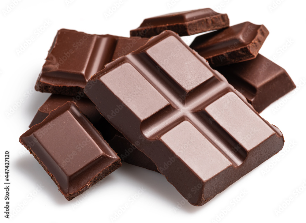 Pieces of dark chocolate bar isolated on white background. Sweet food is made of cocoa and sugar. Pieces of dark chocolate bar isolated on white background. Sweet food is made of cocoa and sugar.